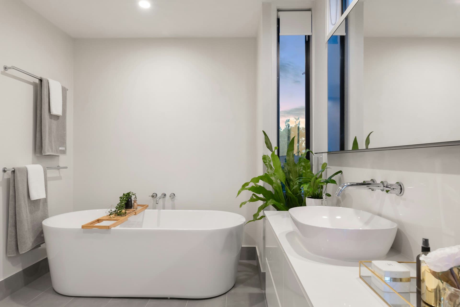 Spa-style primary bath with walk-in shower and freestanding tub